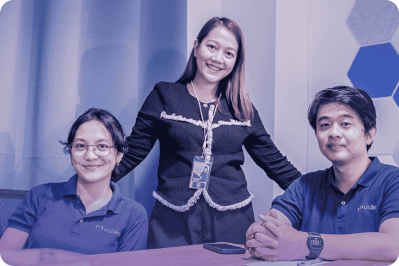 Outdesk team members collaborating at the office, showcasing professionalism and teamwork.